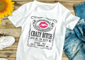 White t-shirt with “Crazy Bitch” design, Love me or hate me. 2 Sisters Tanks Teez
